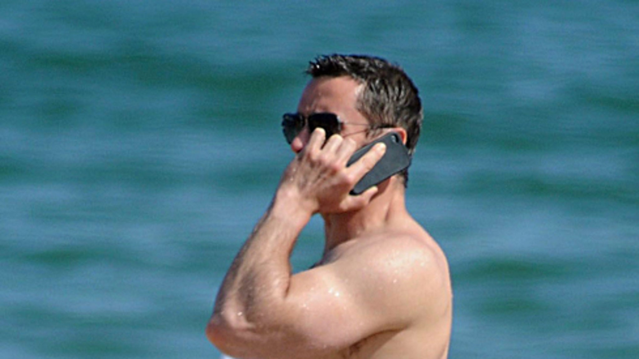 Hugh Jackman Goes Topless To Barcelona Beach