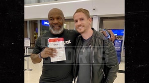 Mike Tyson Poses for Photo with Fan Minutes After Airplane Beatdown