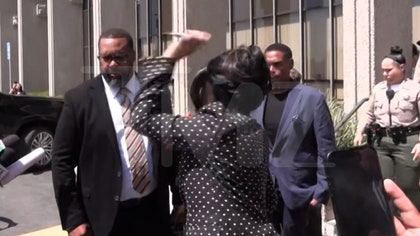 090225_cardi_leaving_court_pen_kal