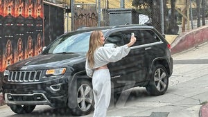 Jennifer Lopez Takes Selfies in Front of Her Own 'Atlas' Billboard