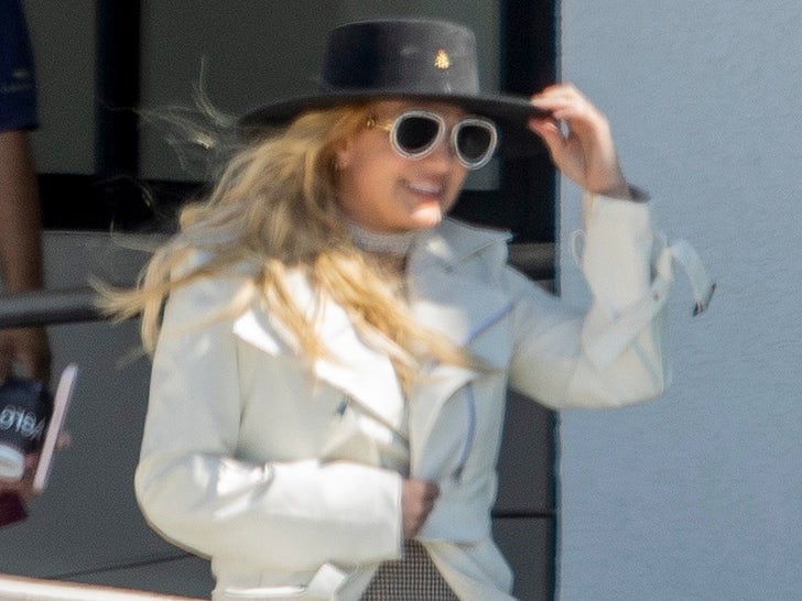 1203-BRitney-Spears-Arriving-In-Mexico-Airport-Hat-Jacket-Photos-primary-2