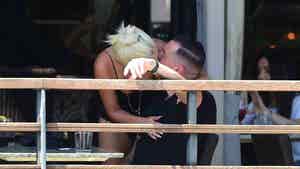 Lady Gaga Shows PDA with Familiar Face to Her