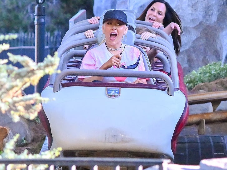 0817-Christina-Aguilera-Disneyland-Scooter-Rides-photos-primary-2