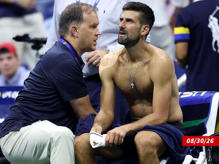 Novak Djokovic of Serbia receives treatment  getty