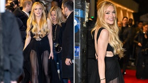 Lindsay Lohan Smiling In A Black Dress Made Of See-Through Tulle