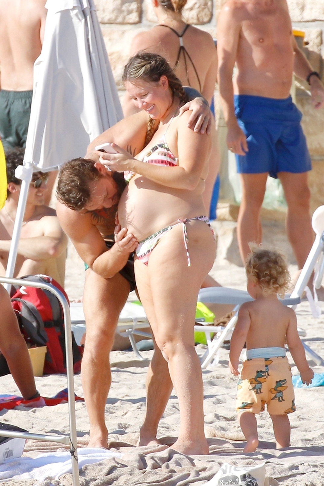 Conor McGregor Kisses Dee Devlin s Baby Bump During Beach Day With