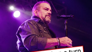 Raul Malo is seen performing at a concert, and he's positioned behind a superimposed text graphic reading 