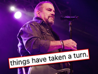 Raul Malo is seen performing at a concert, and he's positioned behind a superimposed text graphic reading 
