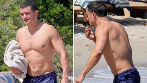 Orlando Bloom Strips Down, Goes For A Swim at Italian Beach