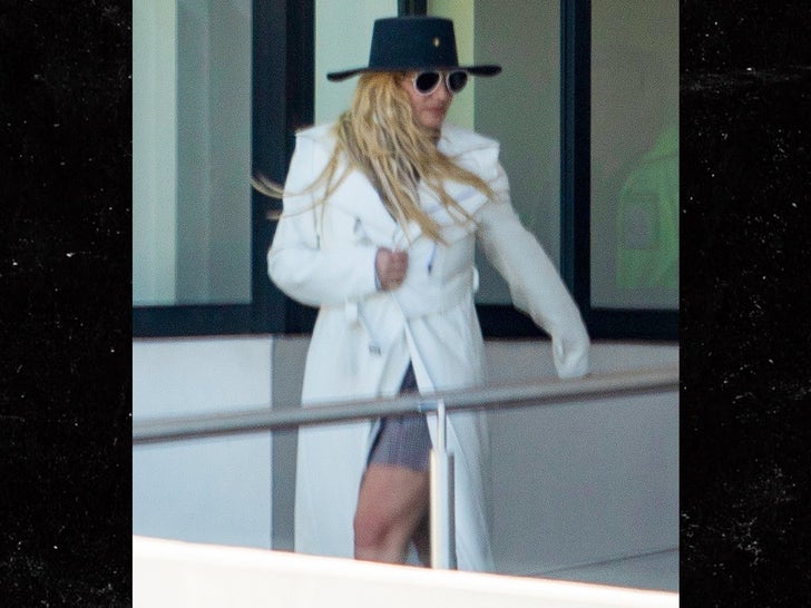 1203-BRitney-Spears-Arriving-In-Mexico-Airport-Hat-Jacket-Photos-primary-3