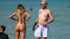 Johnny Manziel Hangs With Bikini Model, Throws Football After Announcing Comeback