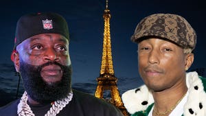 Rick Ross and Pharrell Eifel Tower at night