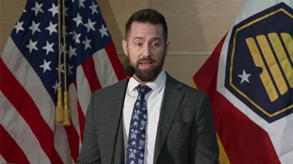 091125_kirk_fbi_presser_weapon_kal