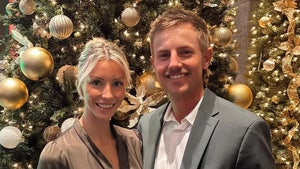 Makena White and Jake Knapp are seen at what appears to be a holiday party. She's wearing a brown dress, while he's wearing a gray coat and a white shirt.