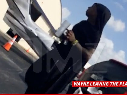 0720_wayne_leaving_plane_tmz_wm