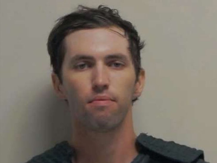 Tyler Robinson is seen while posing for a mugshot.