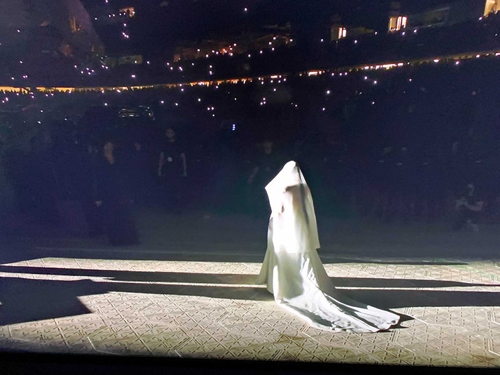 Kim Kardashian Wears Wedding Dress, Joins Kanye at 'Donda