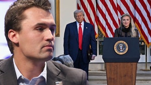 Charlie Kirk is seen looking at Donald Trump watching Erika Kirk address attendees at a ceremony posthumously awarding him the Presidential Medal of Freedom.