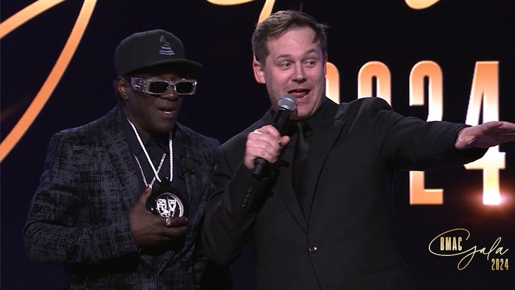 Flavor Flav Spontaneously Auctions Clock Off His Neck for ,000