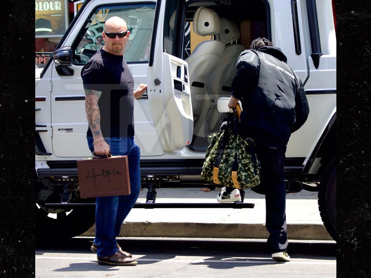 Travis Scott and Security Guard Seen with 'Utopia' Album