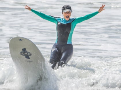 0928-kourtney-kardashian-surfing-ocean-beach-photos-primary