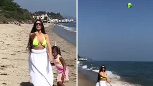 Kim Kardashian Strolls Malibu Beach in Bikini