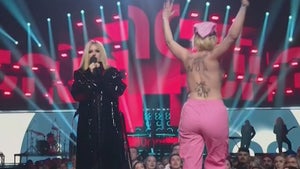 Avril Lavigne Confronts Topless Streaker Onstage at Juno Awards
