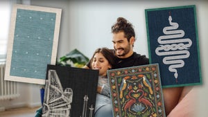 Two People In A Living Room Surrounded By Rugs Available On Amazon