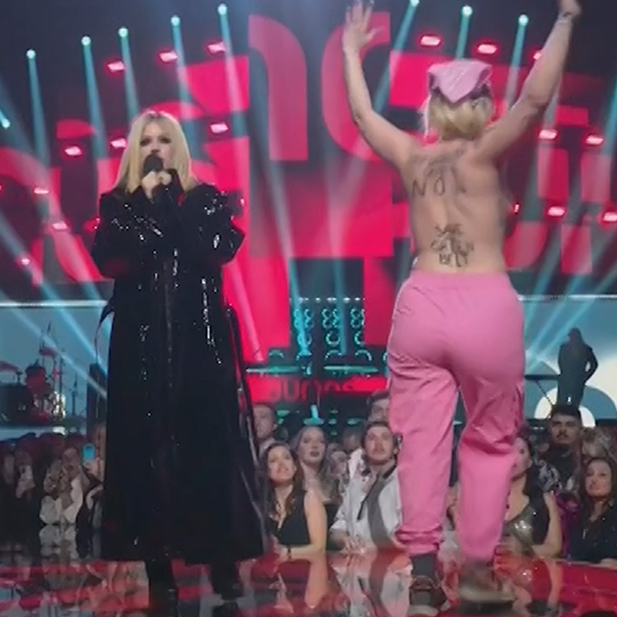 Avril Lavigne Confronts Topless Streaker Onstage at Juno Awards