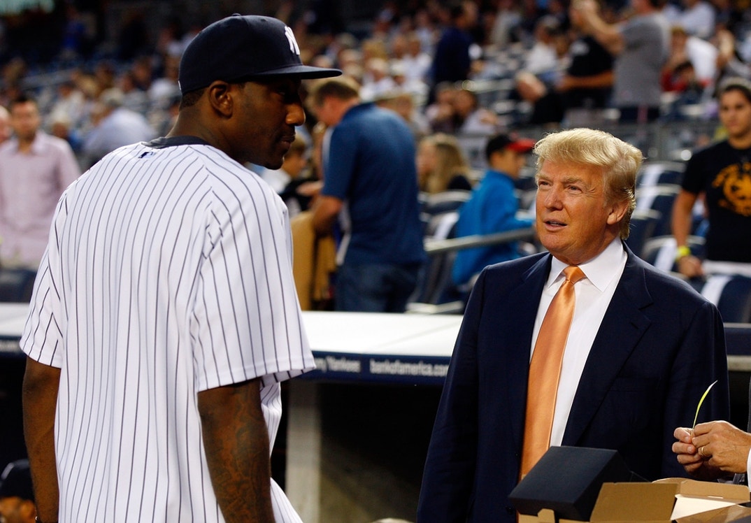 Amar'e Stoudemire of the New York Knicks talks to Donald Trump prior to the game between the New York Yankees and the Tampa Bay Rays at Yankee Stadium in the Bronx borough of New York City.
