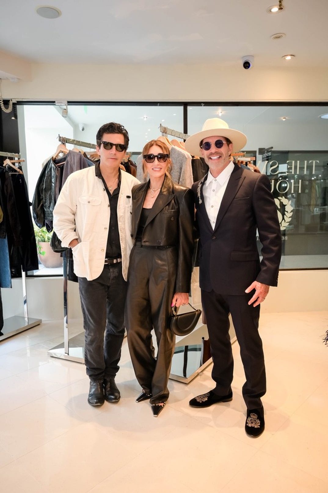 Fashion designer Yigal Azrouël poses with Miriam Smotrich and Dr. David Smotrich, founder of La Jolla IVF
