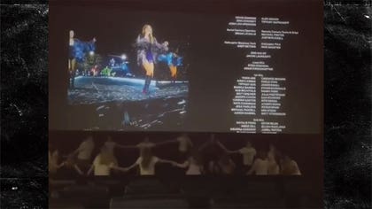 101423-taylor-swift-movie-holding-hands-kal