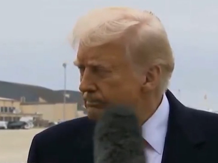 President Trump Hit In Face By Reporter's Microphone