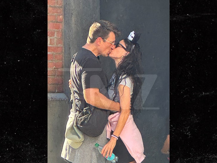 Nathan Fillion and Tania Raymonde at Disneyland tmz 3