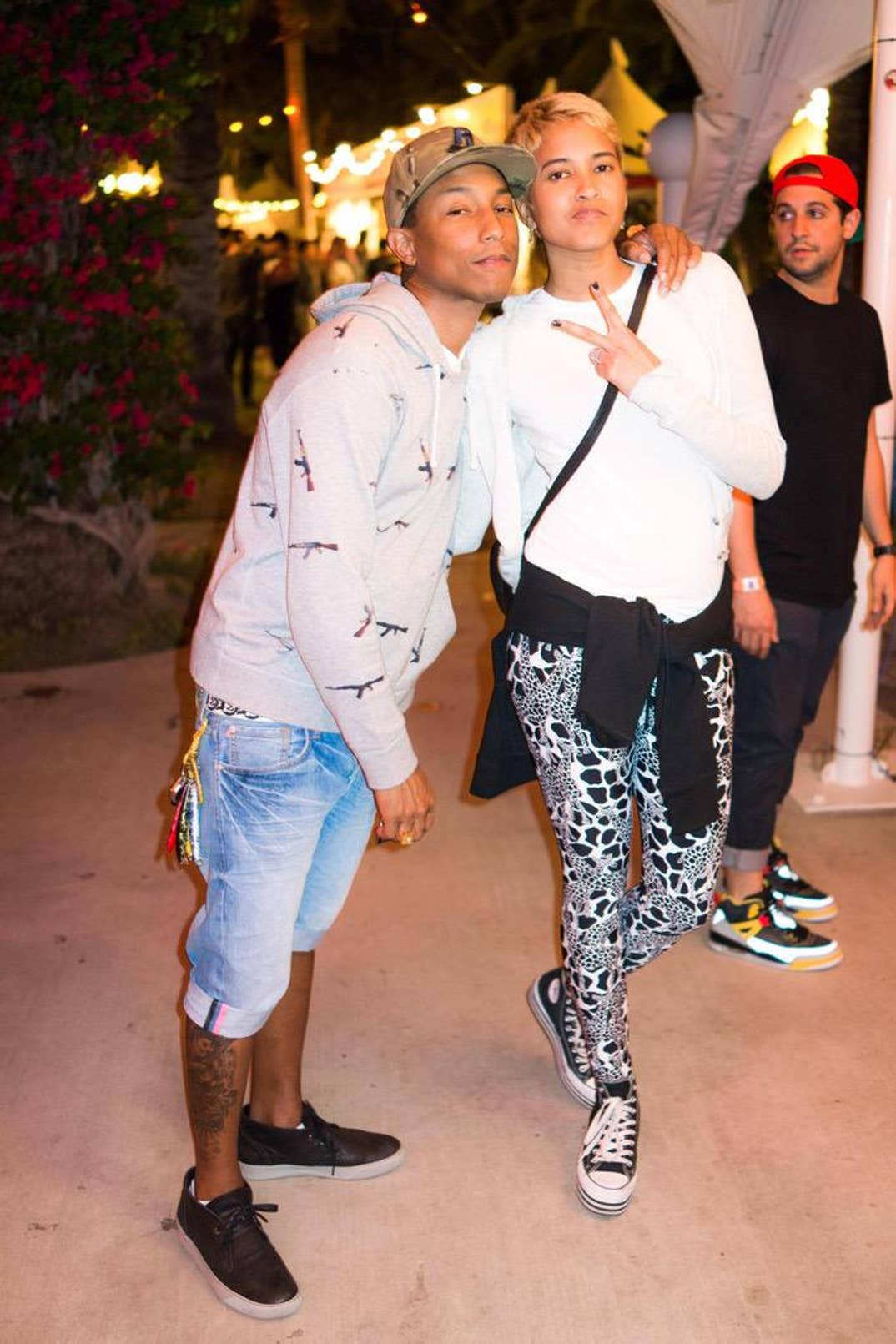 Pharrell Williams and Helen Lasichanh in 2013