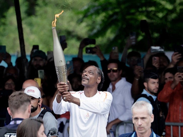 Snoop Dogg Carrying The Olympic Torch In Paris