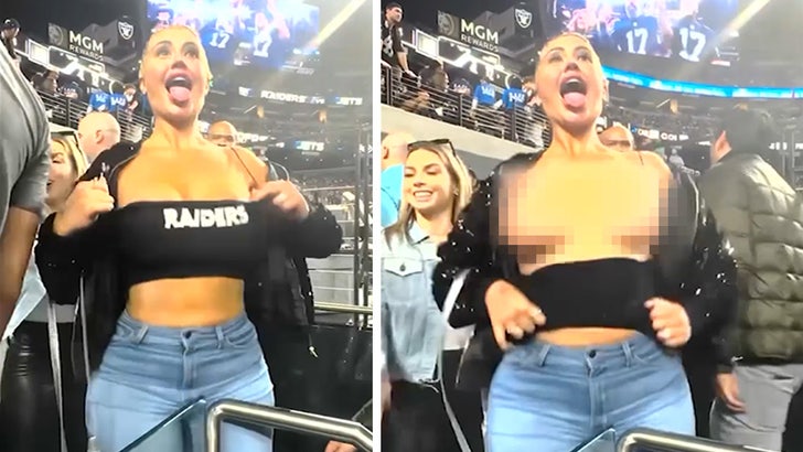 Video: HEAT Fan Boobs Fall Out of Her Top During Game