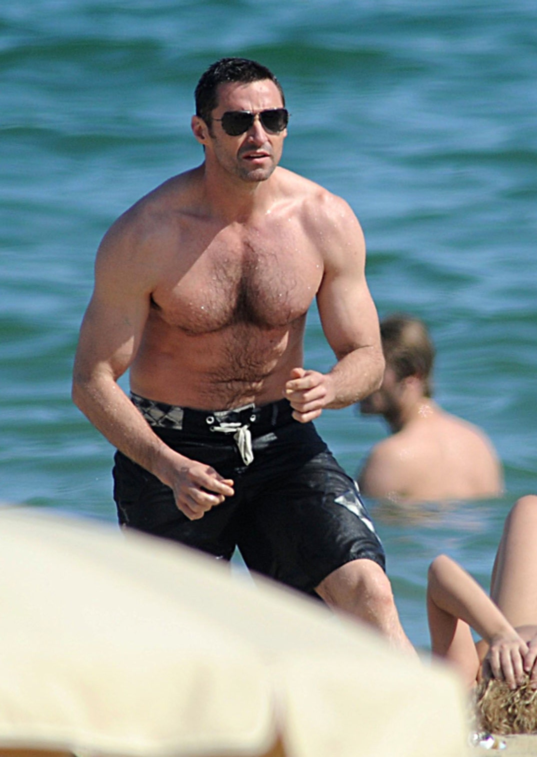 Hugh Jackman Goes Topless to Barcelona Beach