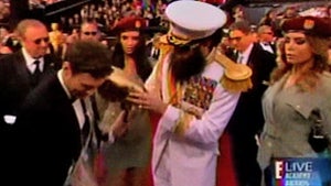 Sacha Baron Cohen -- Spills Ashes All Over Ryan Seacrest at the Oscars