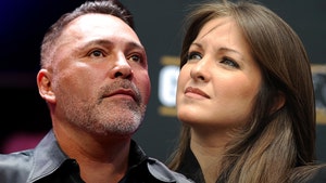 millie corretjer and oscar de la hoya getty 3