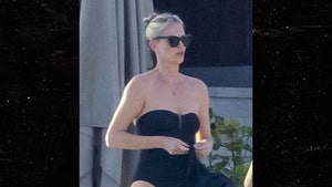 Charlize Theron was spotted on a Mexican beach with her mother Gerda and daughter August as she gears up to celebrate the New Year.