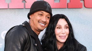 Cher is seen next to her boyfriend Alexander 