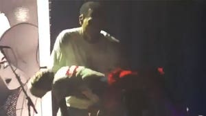 Chris Brown Catches Fainting Kid Onstage