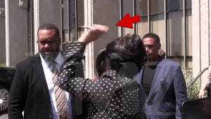 Cardi B throws pen at reporter while leaving court