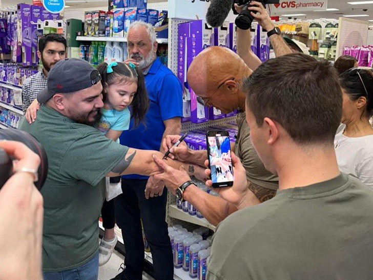 The Rock signing arm
