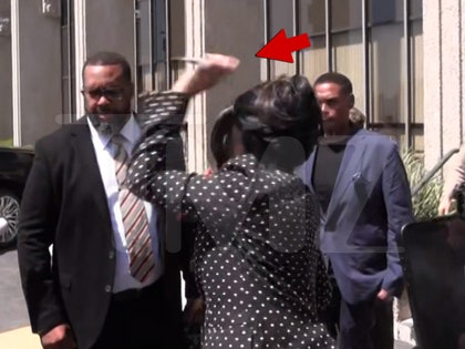 Cardi B throws pen at reporter while leaving court