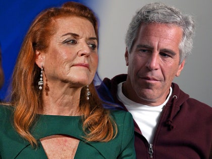 Sarah Ferguson is seen looking off into the distance while Jeffrey Epstein is behind her. She's wearing a green dress, while he's wearing a white t-shirt and maroon hoodie.