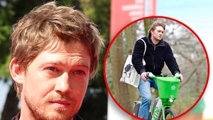 Joe Alwyn Looks Downcast Riding Bike Day After Christmas in London