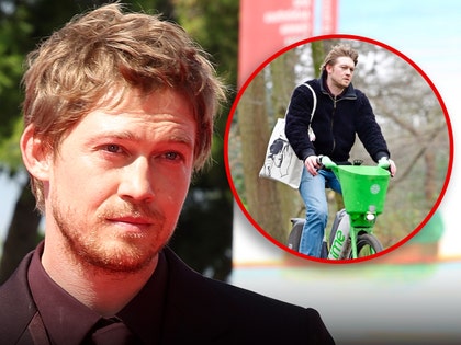 Joe Alwyn Looks Downcast Riding Bike Day After Christmas in London