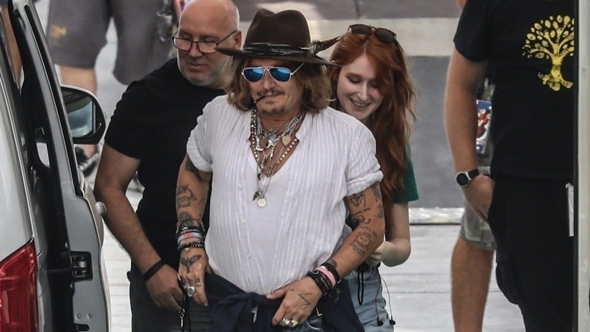 Johnny Depp's Mystery Redhead Revealed as French Teacher for Upcoming Movie thumbnail